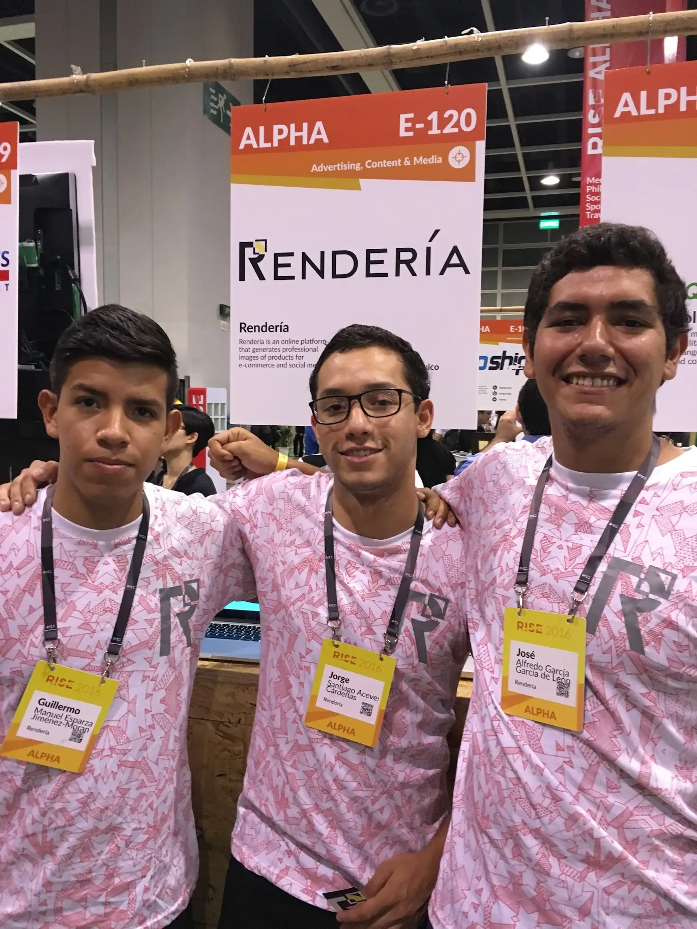Memo and his two Rendería co-founders at the company's ALPHA stand, E-120, at RISE 2016 in Hong Kong, in matching printed team shirts and RISE 2016 badges
